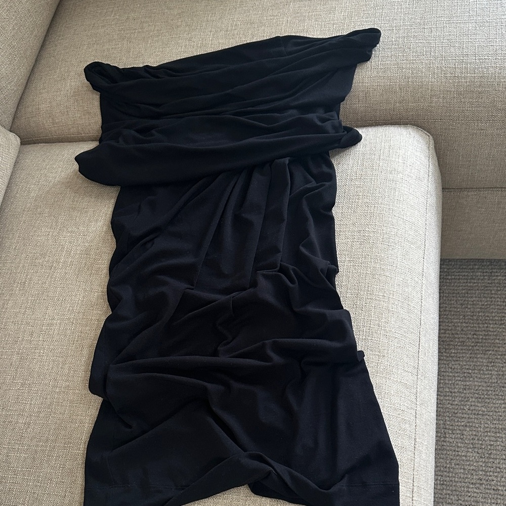 Donna Karan Elegant Black top, off the shoulder twist at hip waist.